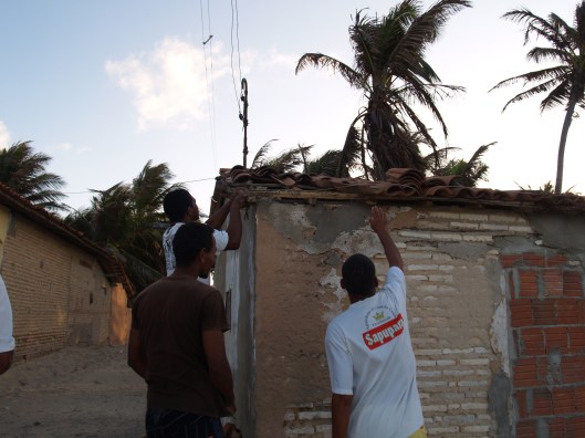 Inspecting the roof of the old house