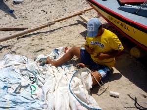 Hand stitching a sail