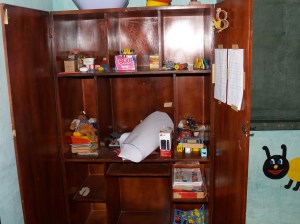 The bare classroom cupboard.