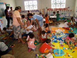 Children and teachers delighting in the new materials donated by Brookfield School, in North West London