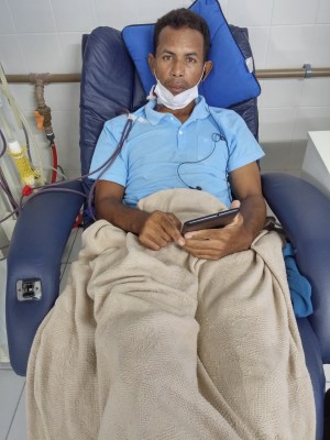 Dialysis sessions are long, boring and very tiring. The two tubes connect to the catheter in his neck, taking blood from him to the machine beside him for cleaning and then returning it to his system..