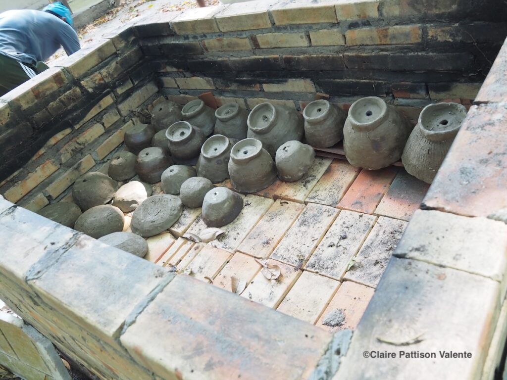 loading the pots into the kiln