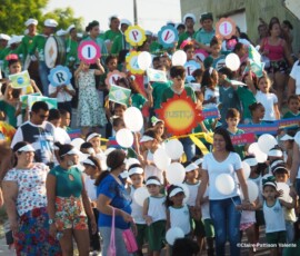 Group of children and adults on a school parade, Prainha do Canto Verde